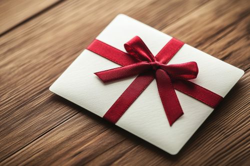 © Usman - stock.adobe.com Foto: Geschenkumschlag mit Schleife
